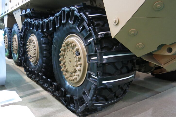 ST Kinetics’ TERREX Armored Personnel Carrier (APC) is equipped to move in water, the new ‘Track Over Wheel’ concept uses a rubber track that wraps over the frontal two wheels of the 8x8 vehicle, to give better traction and lower ground pressure mobility over soft and difficult terrain. Photo: Tamir Eshel, Defense-Update